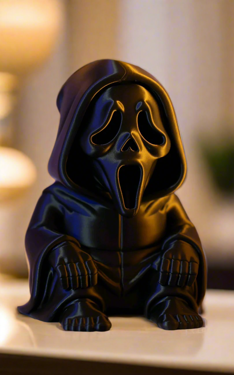 Ghostface chibi horror collectible with bokeh golden background