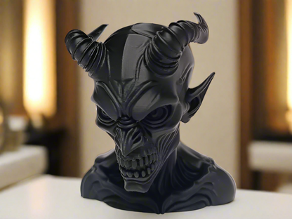 Black devil head sculpture on a blurred background