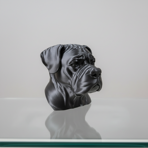 Black dog sculpture on a glass table with a blurred background