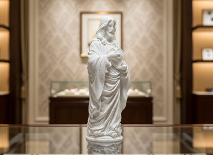 White statue of a religious figure in a decorative setting