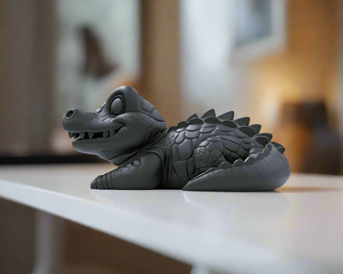 Cute gray alligator figurine with smiling face and playful expression showpiece