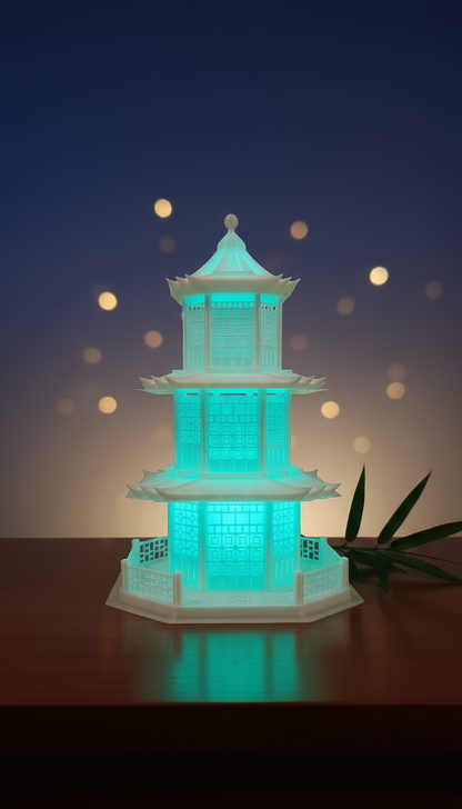 Japanese Pagoda Night Lamp with LED lights glowing in cyan blue for home decor and temple decoration