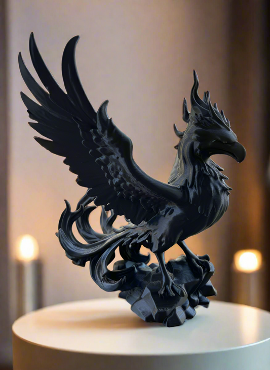 Black phoenix figurine sculpture with pedestal and warm lighting showpiece